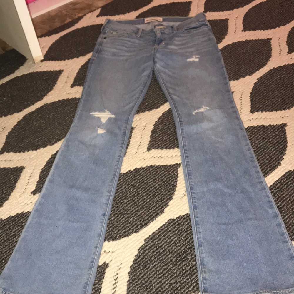 Light wash flare jeans with holes